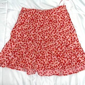 a pink skirt with butterfly designs on it